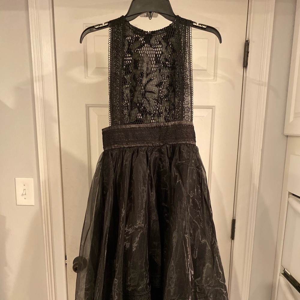 Boutique faux leather high/ low dress.